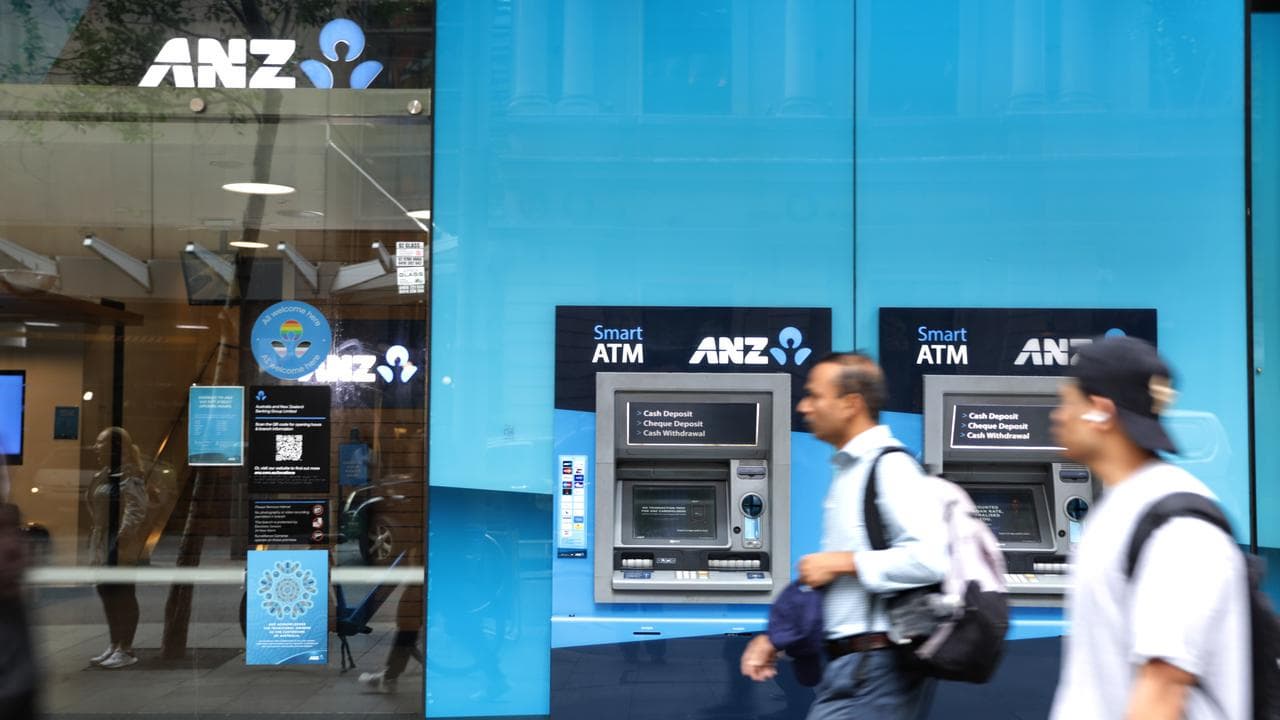 People walk past an ANZ storefront in Sydney