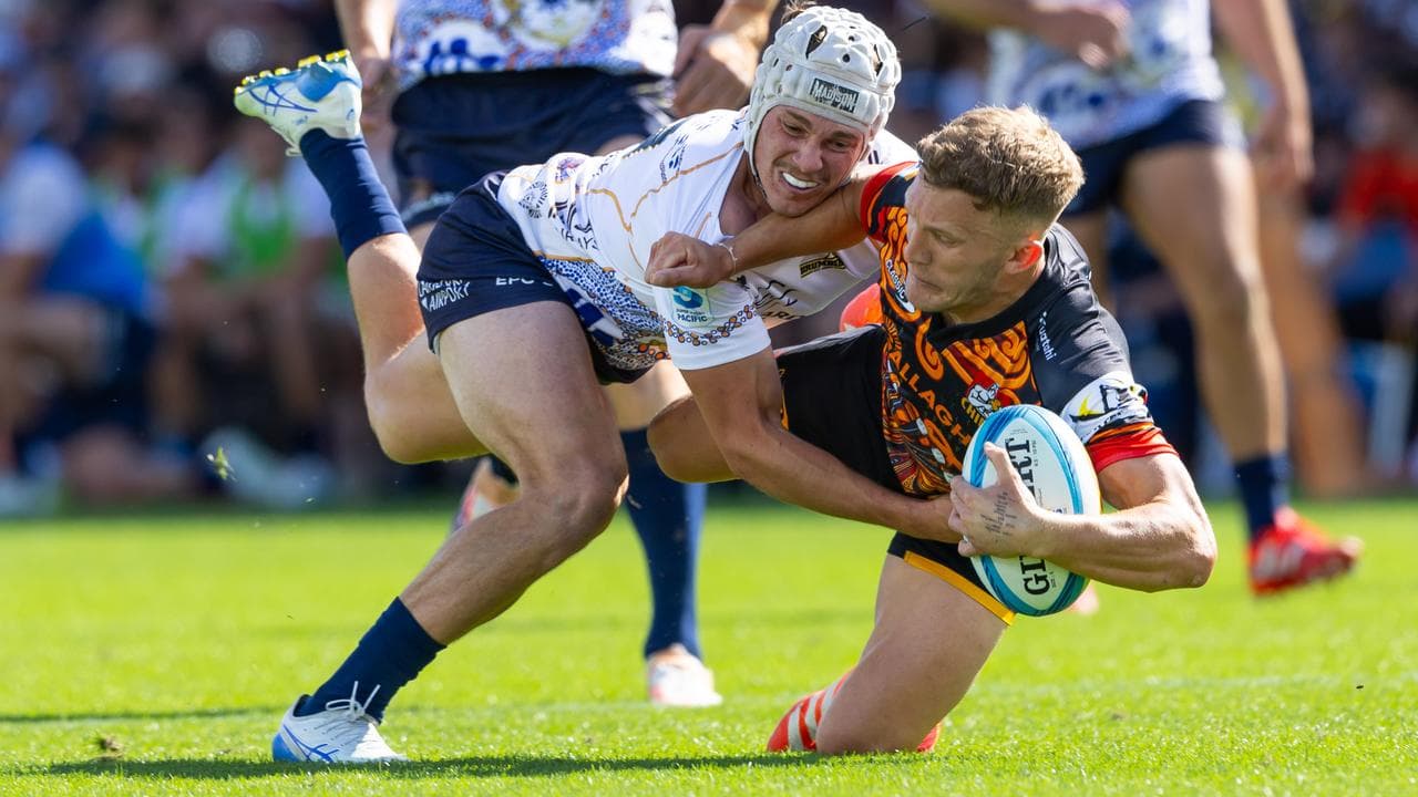 Declan Meredith of the Brumbies stops the Chiefs' Damian McKenzie