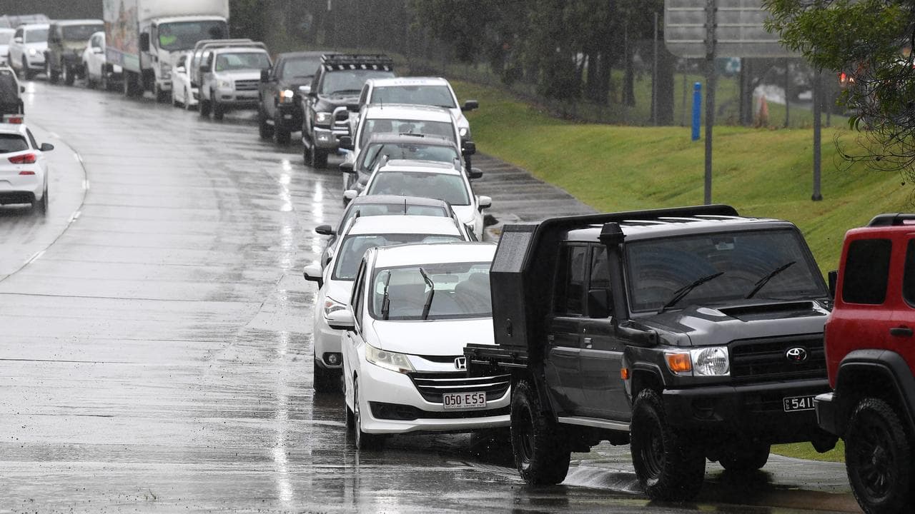 People line up for sandbags.