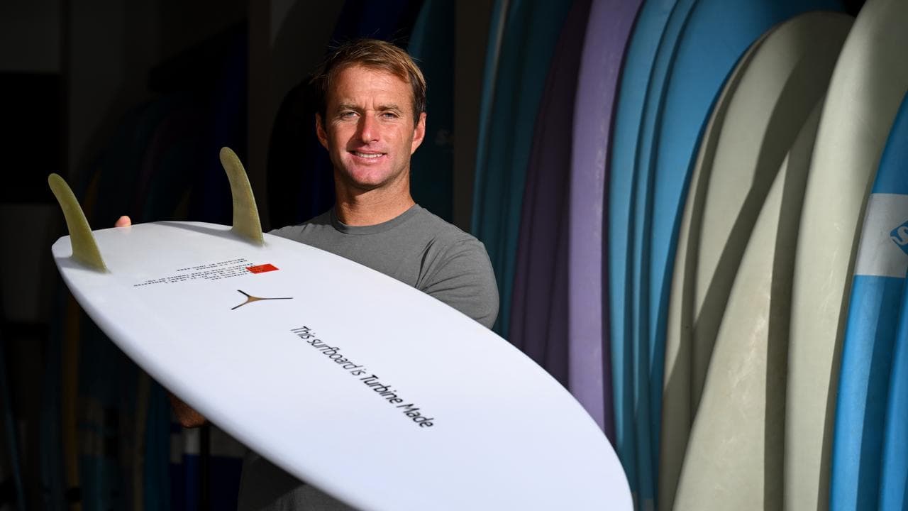 Surfboard shaper Josh Kerr with a Turbine Made surfboard