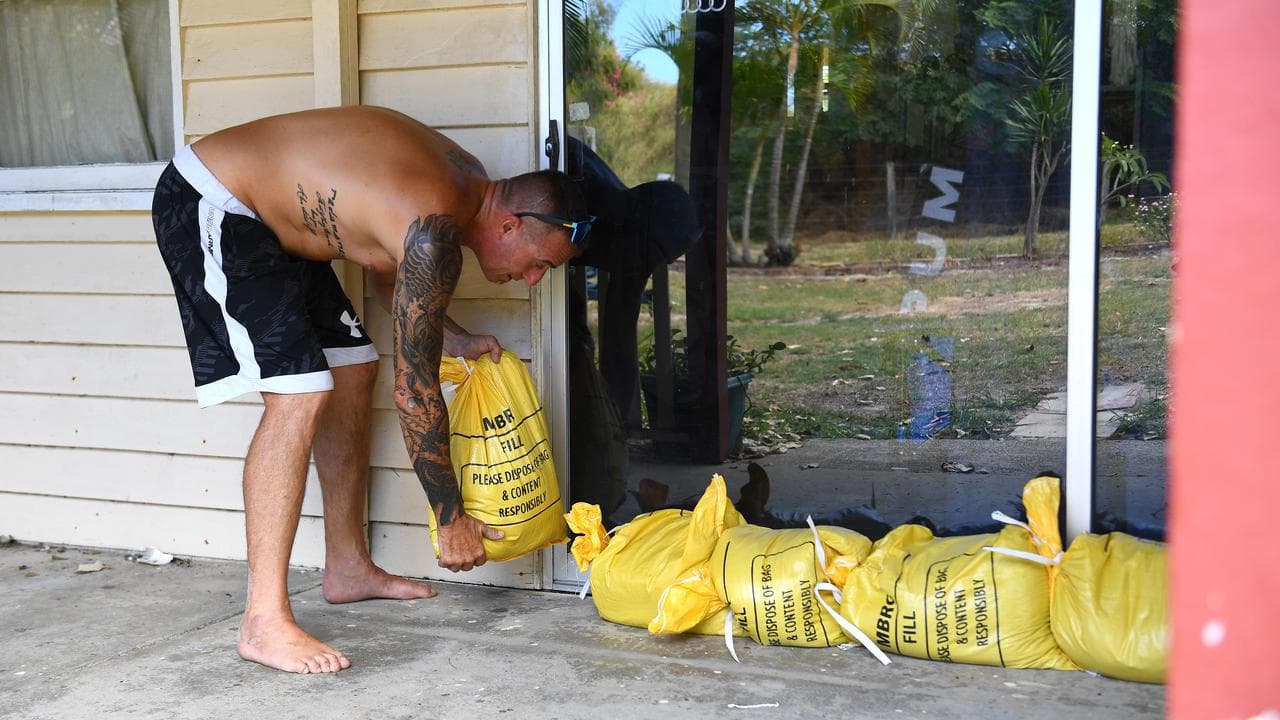 Resident Jon Wadey sandbags his Bribie Island home