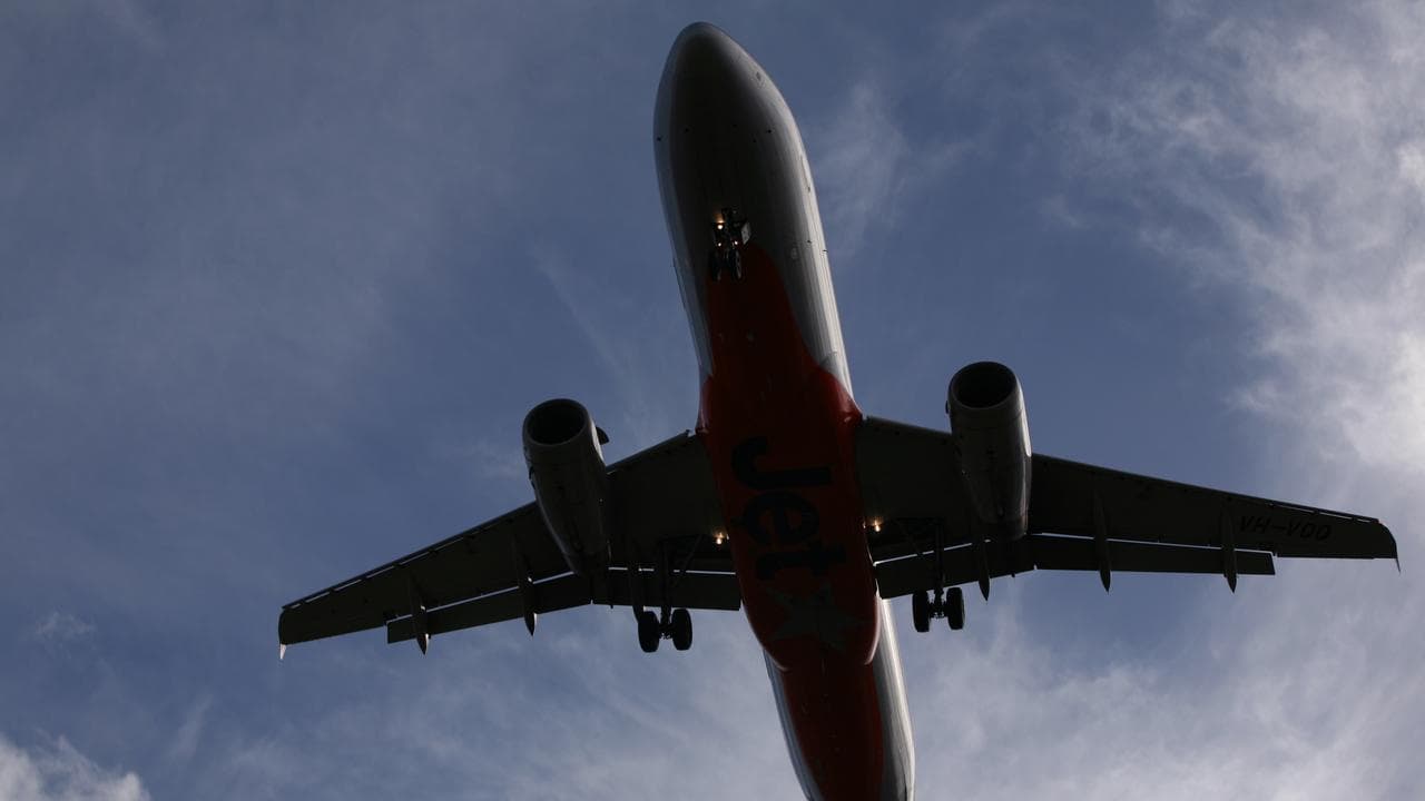 A twin engine jet makes its final approach to Sydney Airport 2011