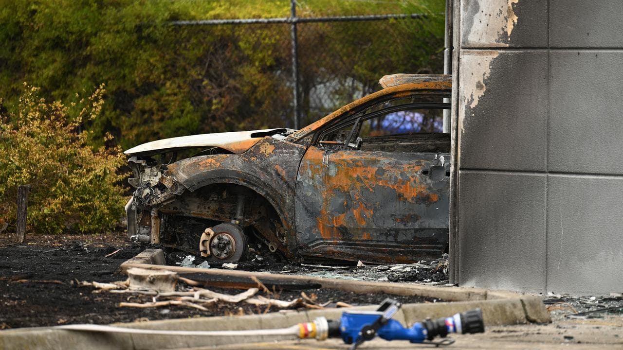 A car was set alight inside a factory.