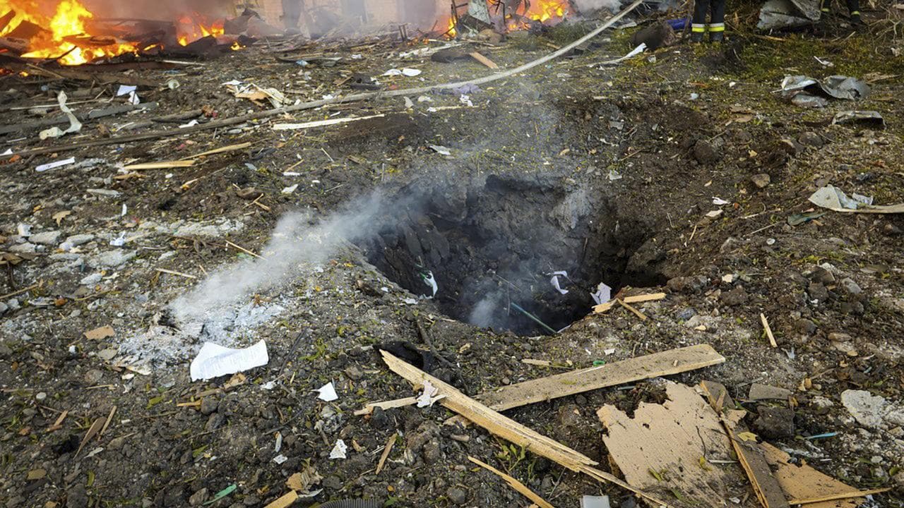 Firefighters at work after a Russian attack in Kharkiv