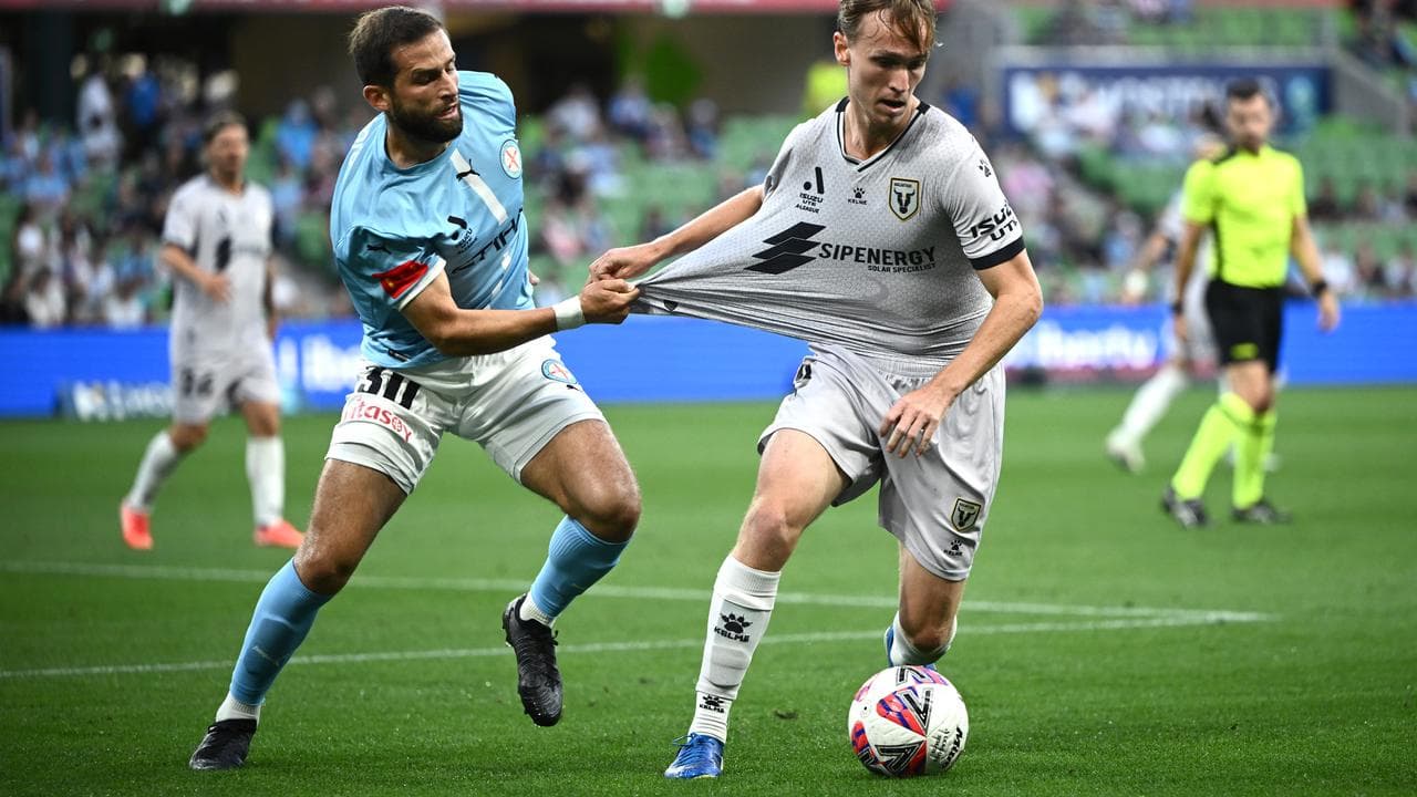 City's Aziz Behich marks Macarthur's Kealey Adamson.