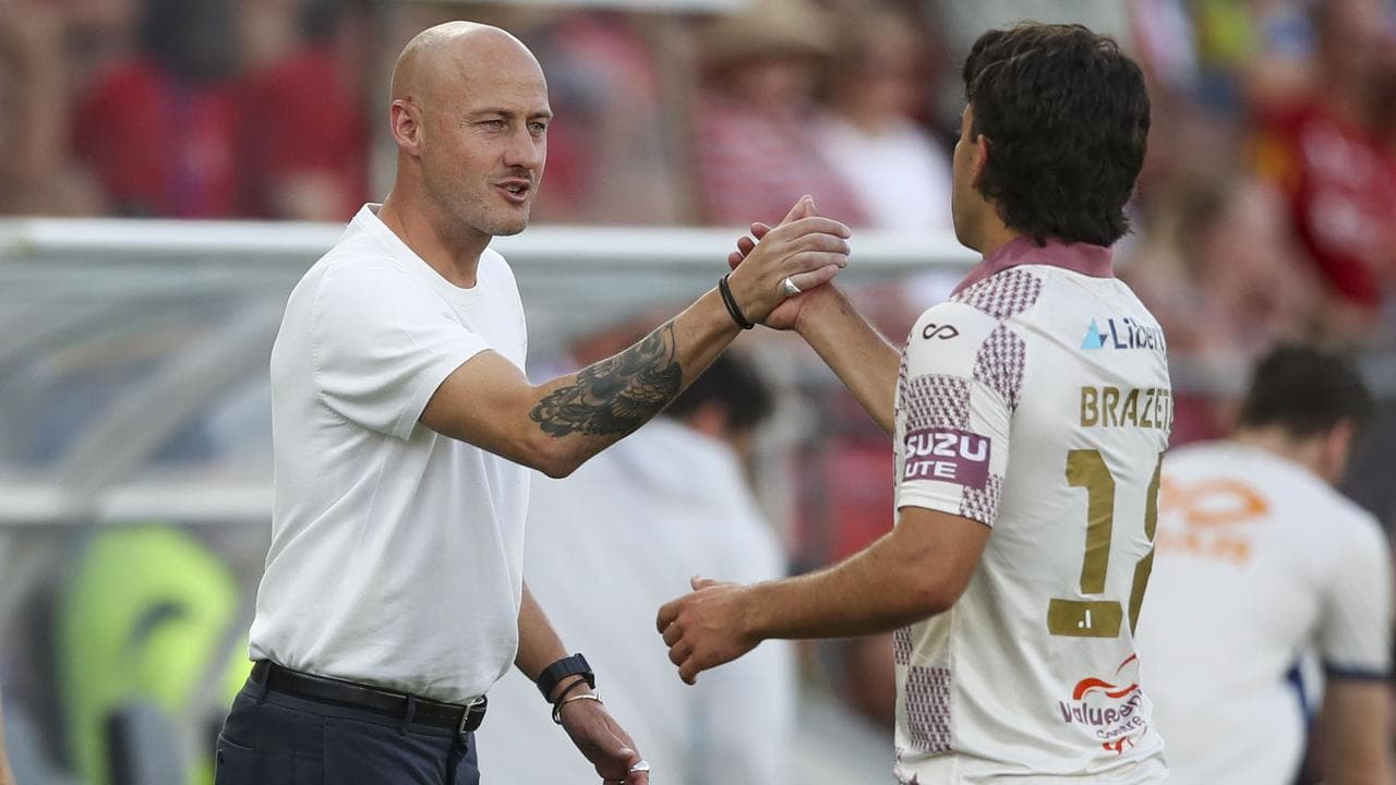 Roar coach Ruben Zadkovich (left) congratulates Jacob Brazete