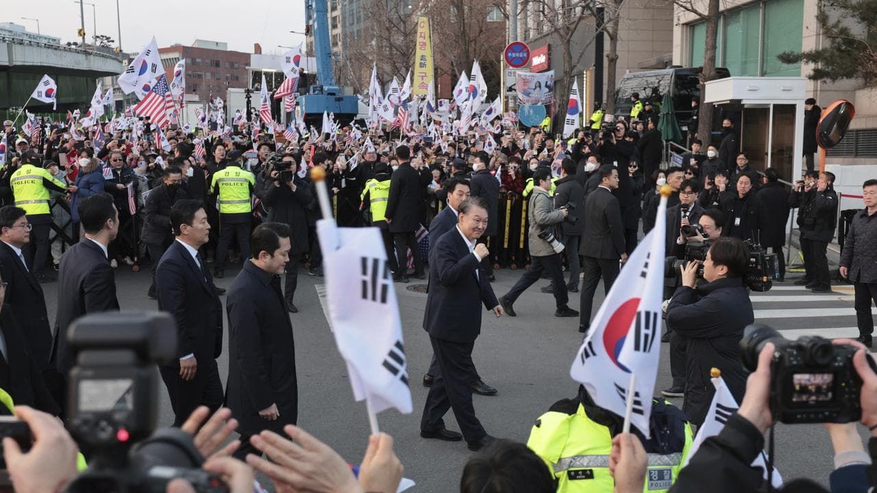 South Korea President Yoon Suk-yeol greets supporters outside prison