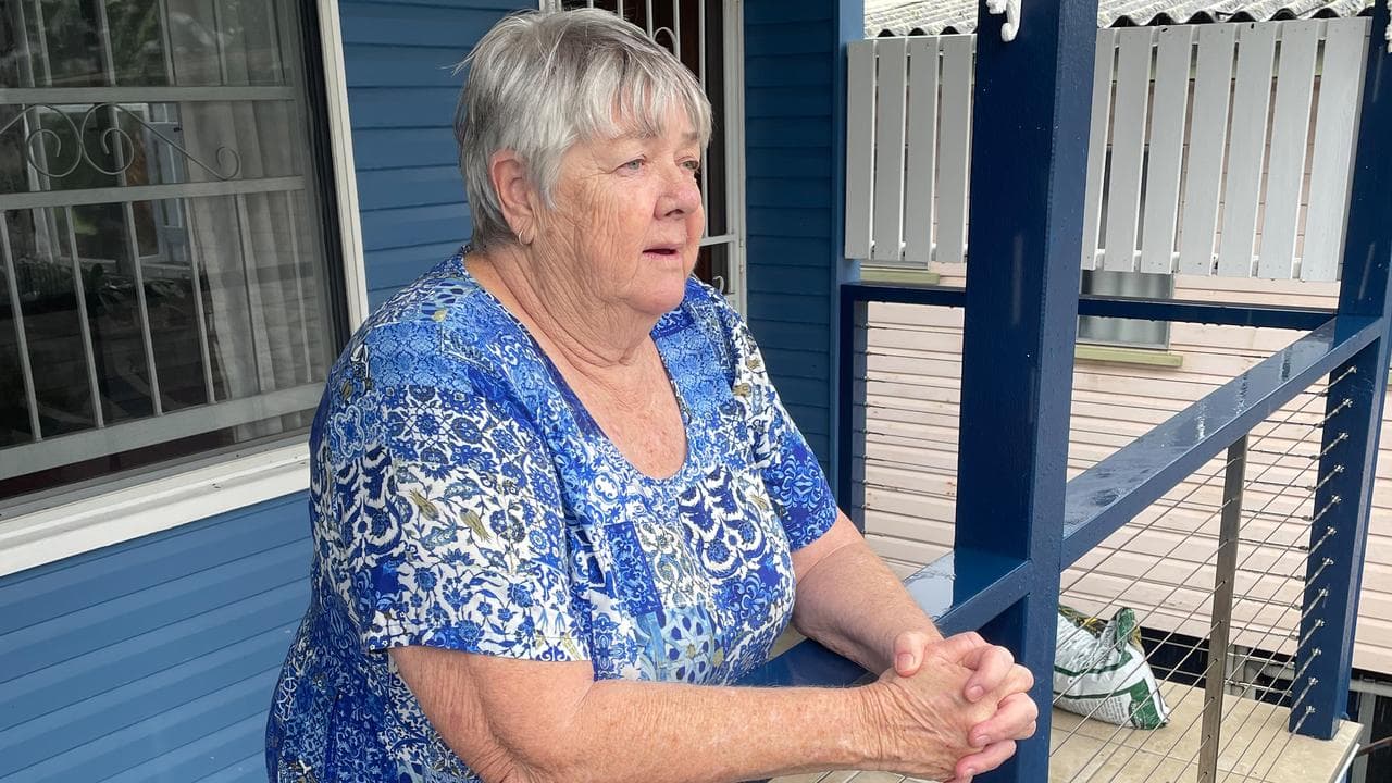 Sue Bell watches rising floodwaters
