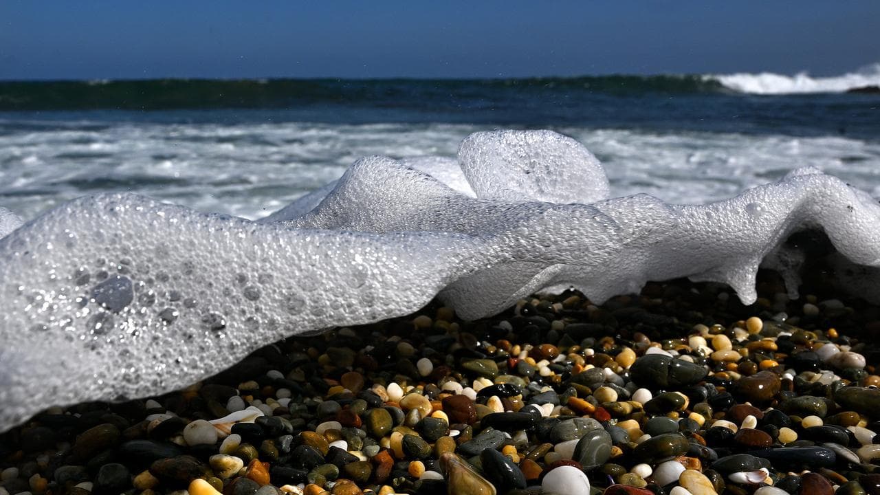Waves washing across pebbles (file image)