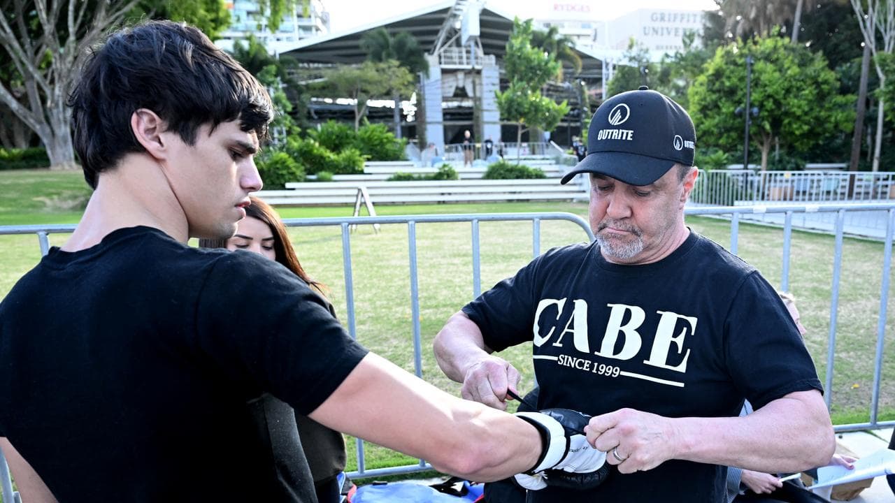 Jeff Fenech (right) checks the gloves of Brock Jarvis
