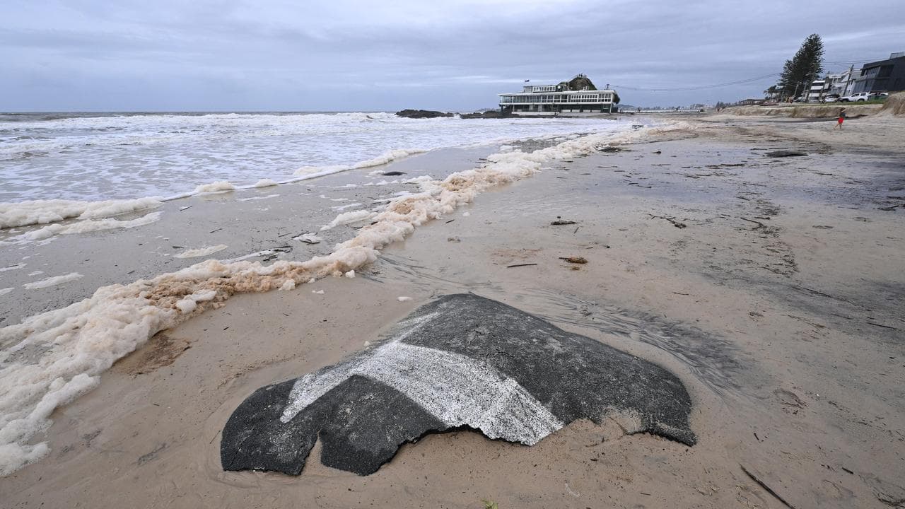 Bitumen washed up on the beach on the Gold Coast