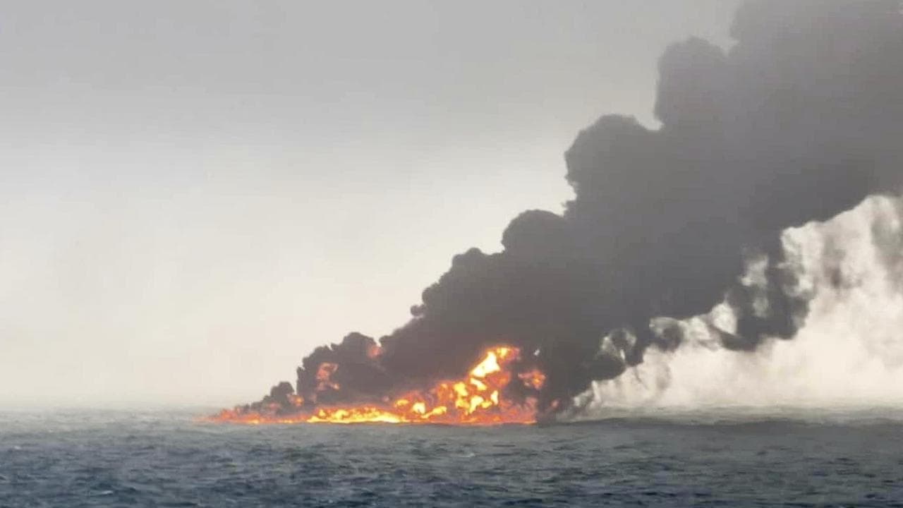 Smoke from a vessel after a cargo ship hit a tanker off England