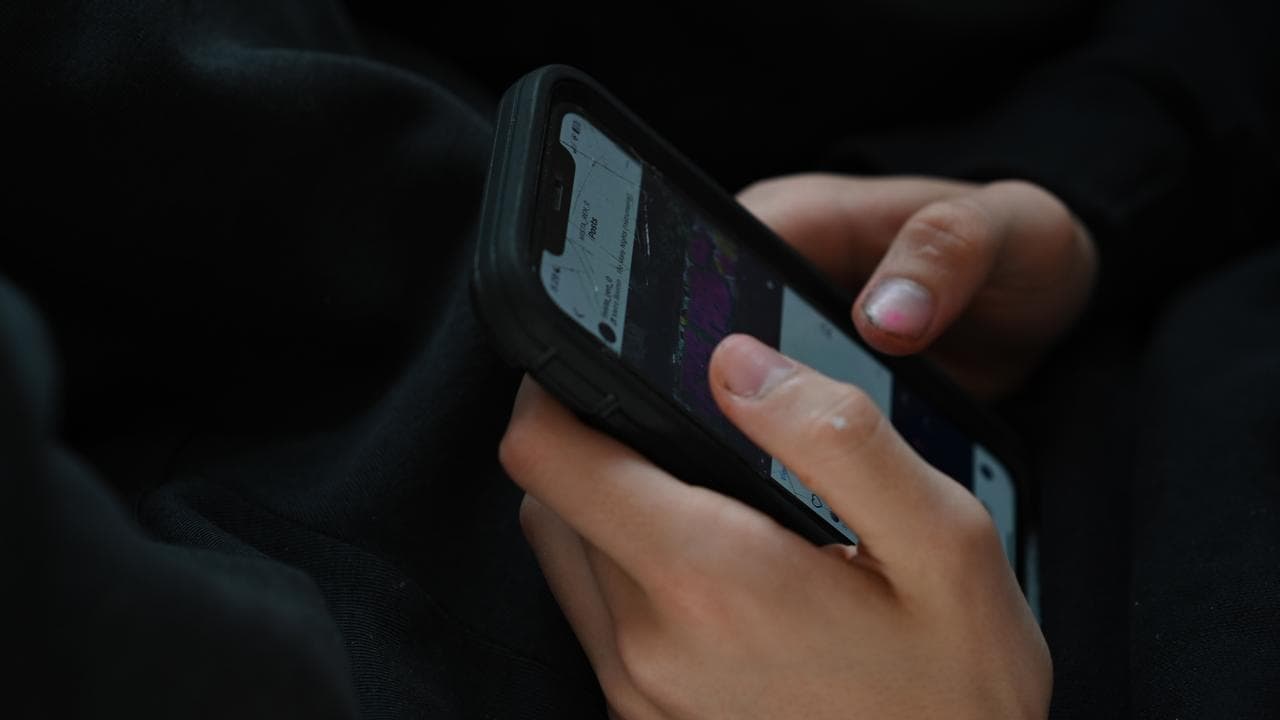 Person using social media on smartphone.