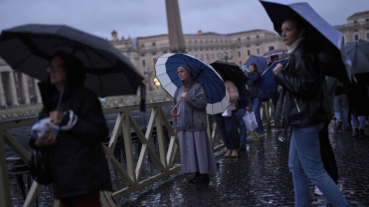 People pray for Pope Francis in St Peter's Square, the Vatican