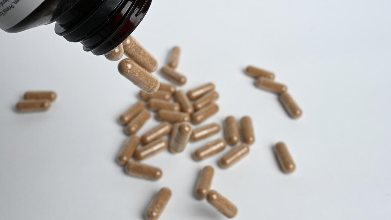 Pills being poured from a bottle