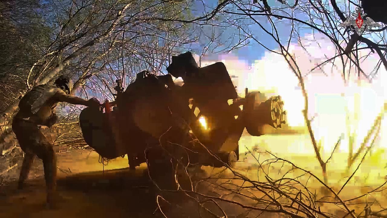 A Russian soldier fires a gun at a Ukrainian position in Kursk