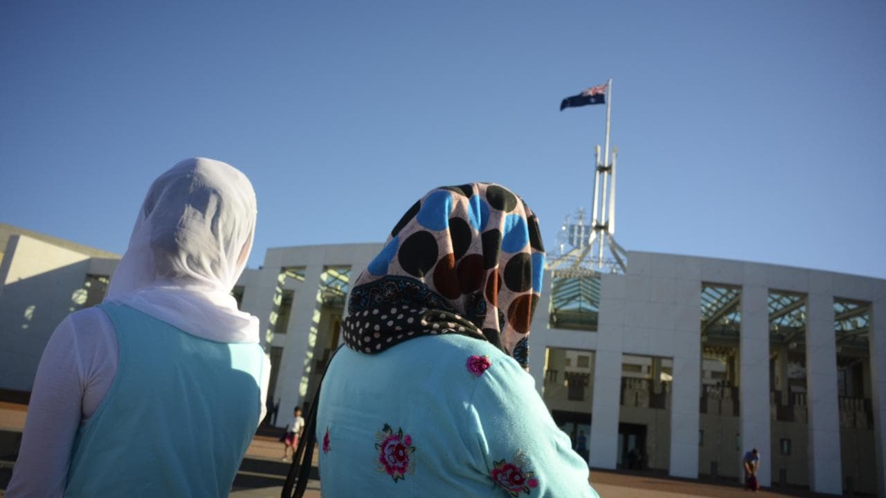 Women wearing hijabs outside parliament