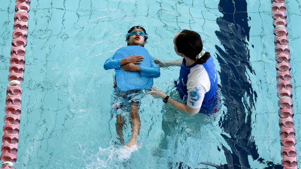 Child participates in swimming lesson