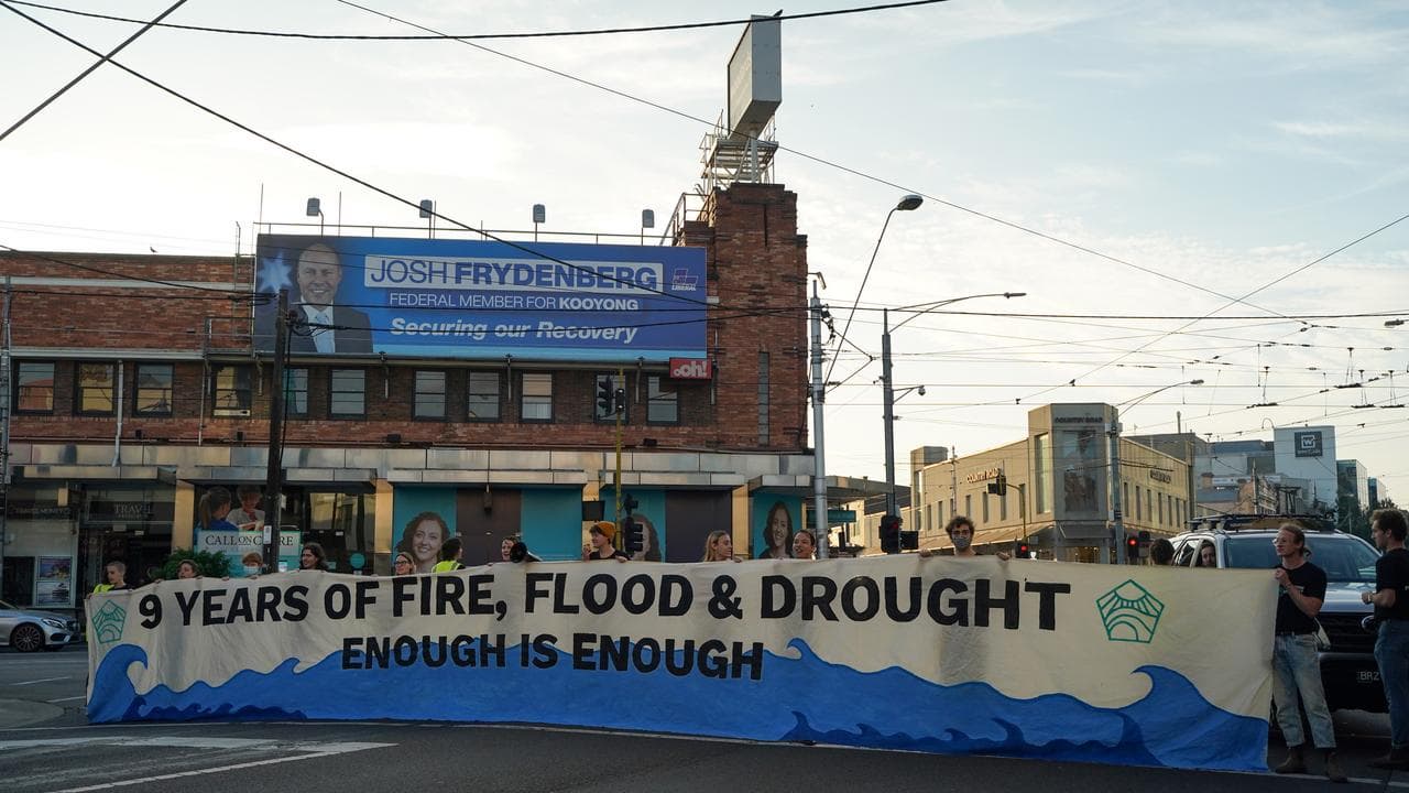 People campaigning for climate action during the 2022 election