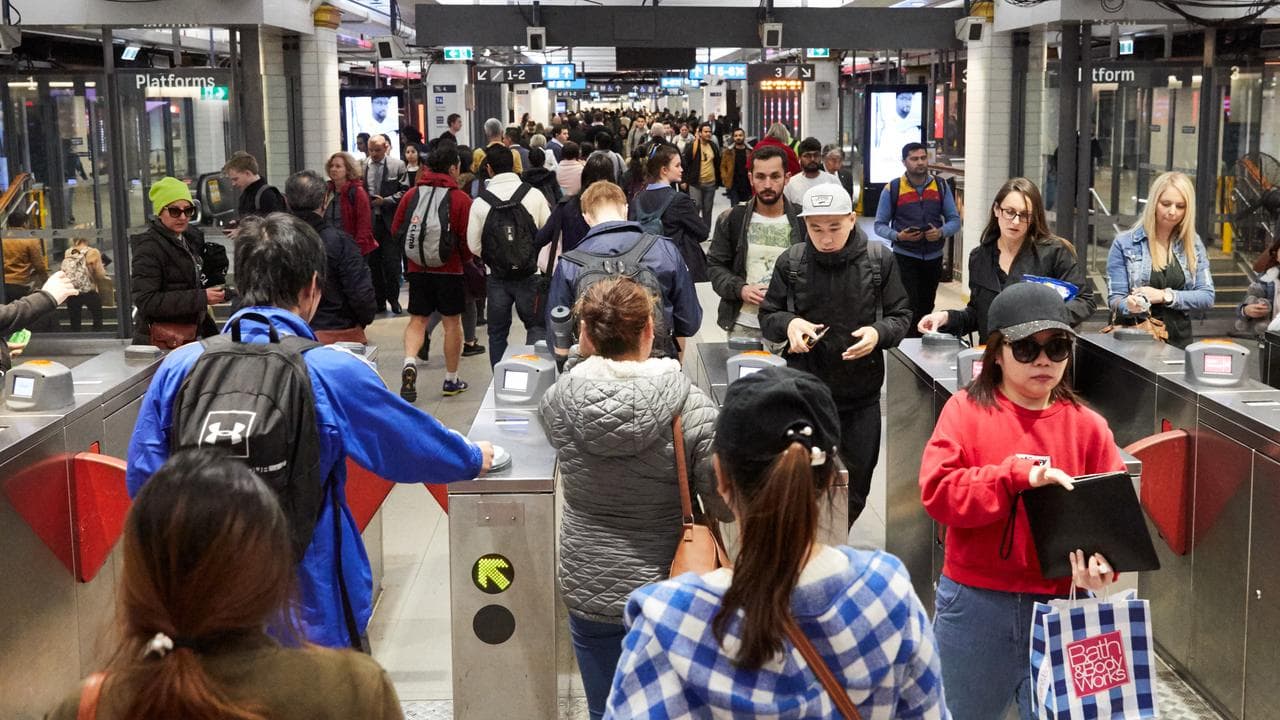 Commuters are seen in Town Hall station during peak hour in Sydney