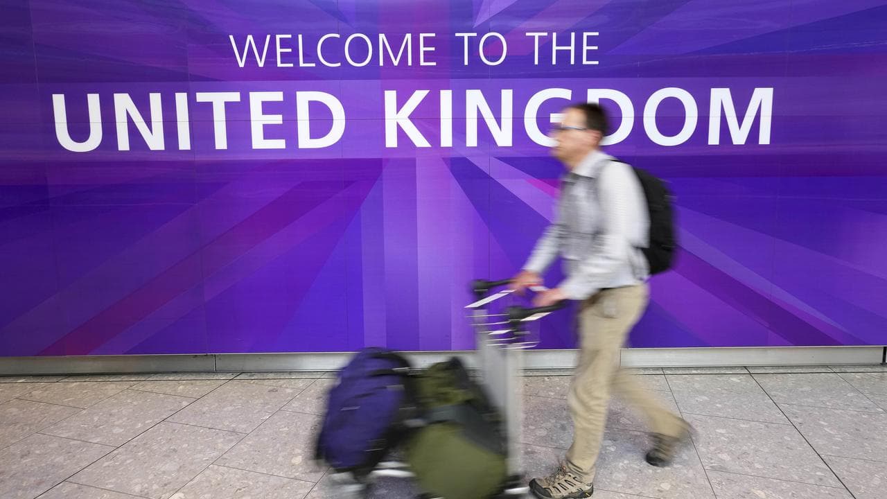 A traveller arrives at Terminal 5 as Heathrow Airport
