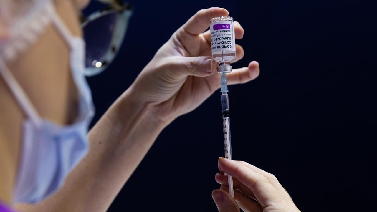 A nurse fills a syringe (file image)