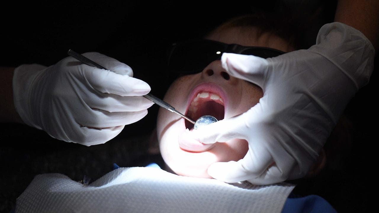 A young child during a dental exam (file image)