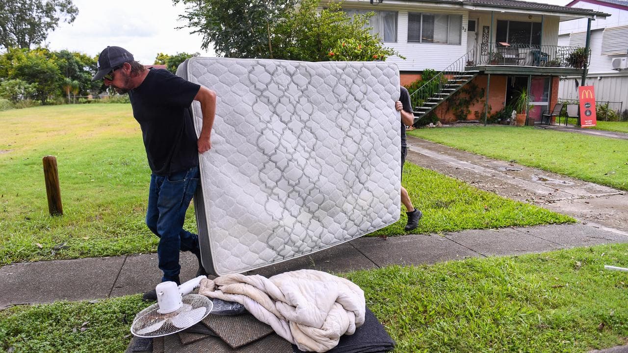 A man cleans up after a cyclone