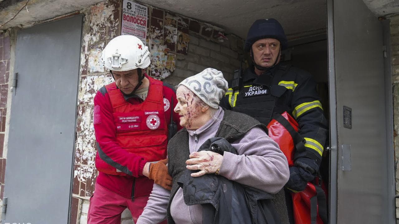 Elderly woman taken from the site of a rocket strike in Sumy, Ukraine