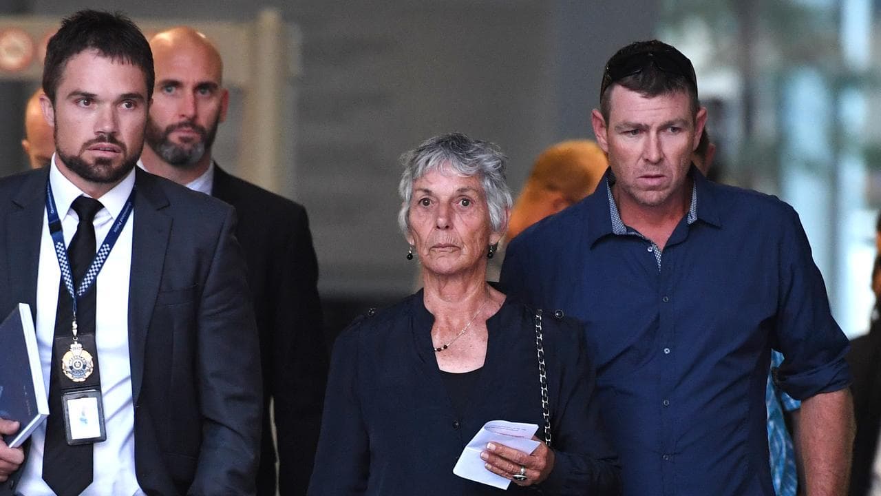 Inspector Jay Notaro (L) leaves court with a victim's relatives