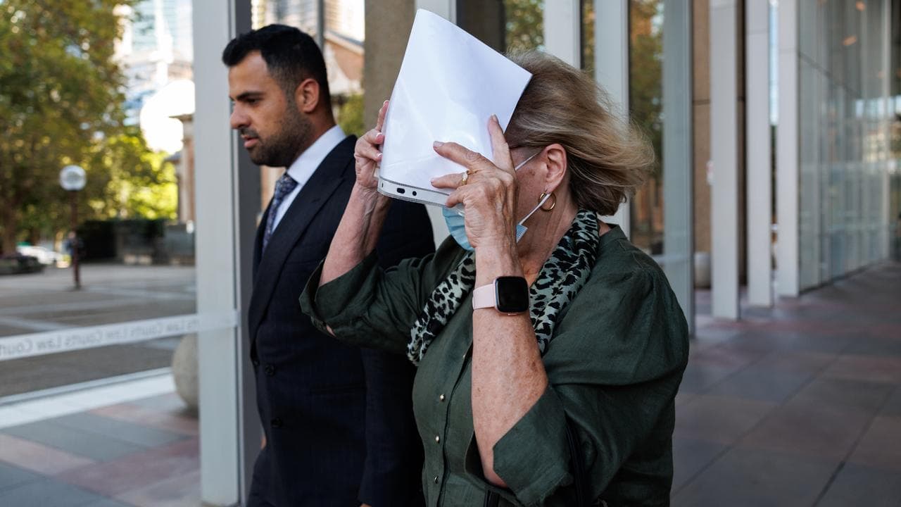 Helga Lam (right) leaves the Supreme Court of NSW
