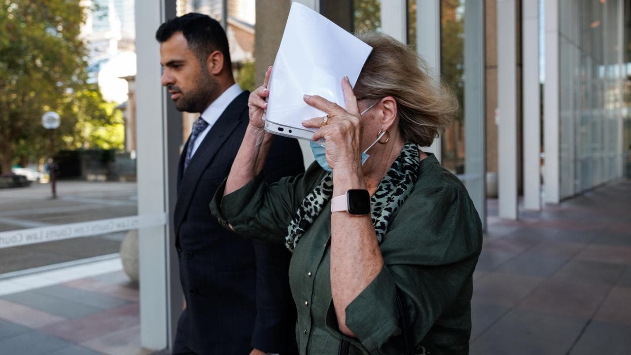 Helga Lam (right) leaves the Supreme Court of NSW