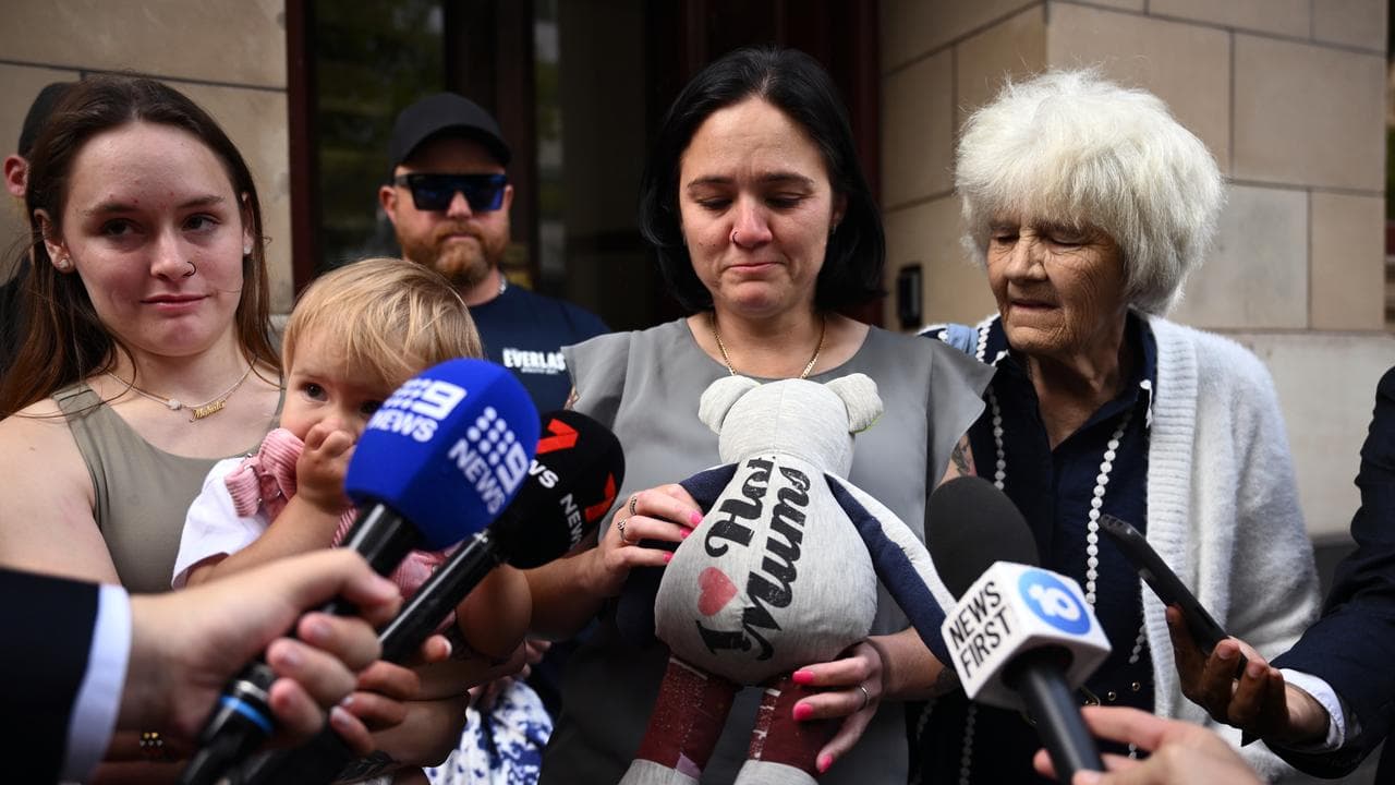 Rebekah Allen (centre), wife of victim Clint Allen, speaks to media