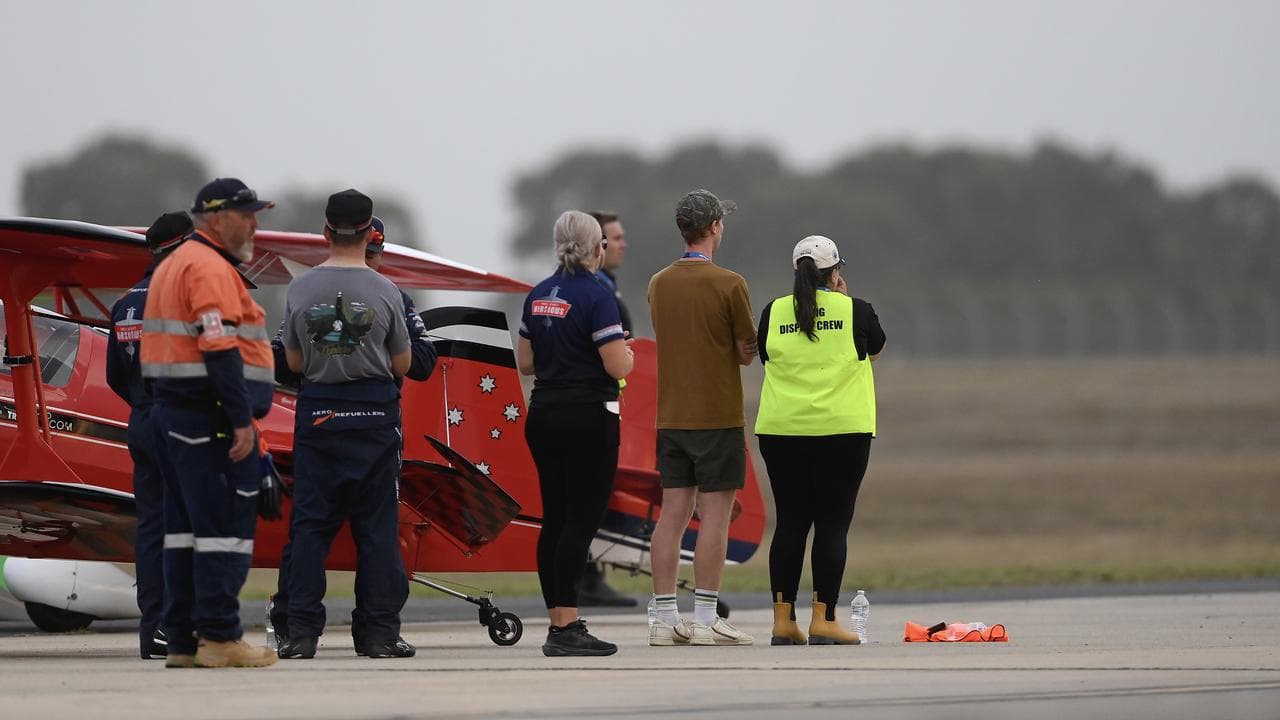 SkyAces Formation Aerobatic Team members watch after the crash