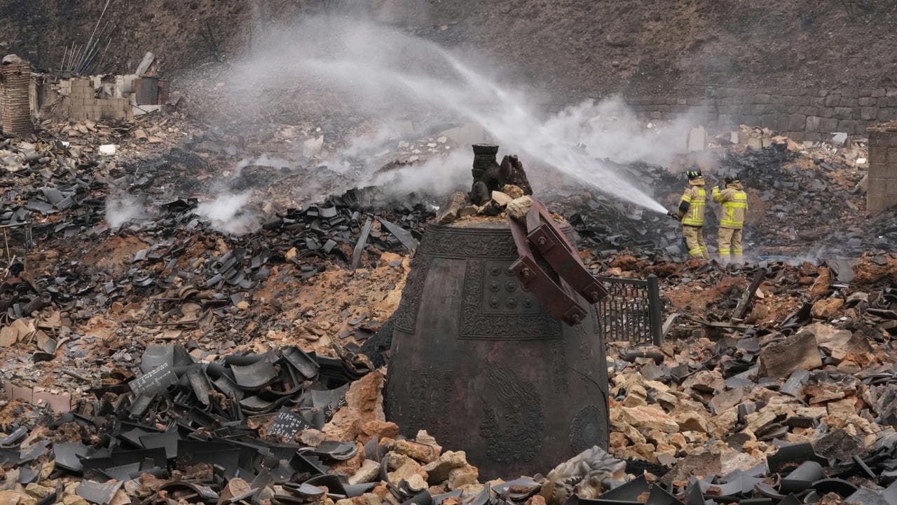 Firefighters at the Gounsa Temple in Uiseong, South Korea