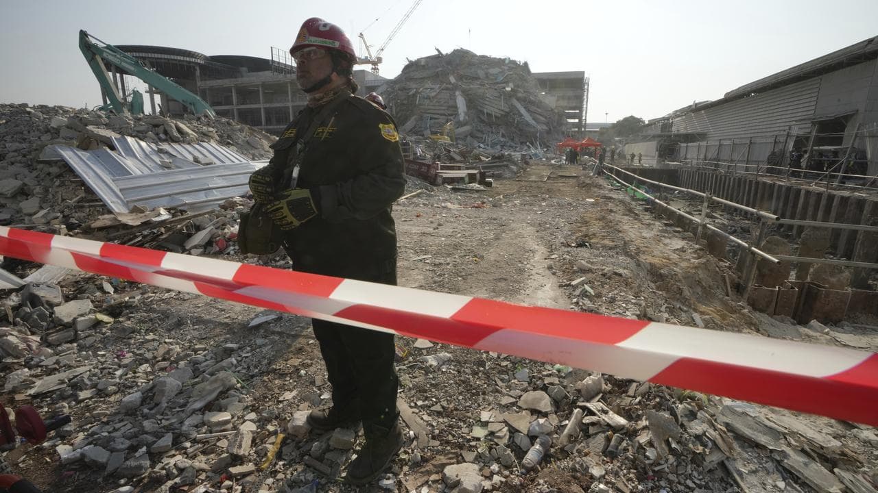 Rescuer at the site of a collapsed high-rise after qauke in Bangkok