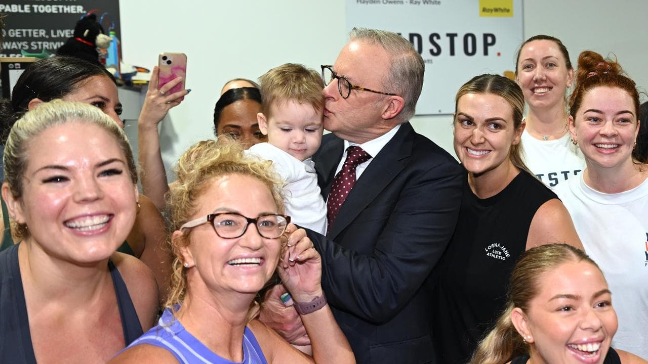 Prime Minister Anthony Albanese kissing a baby