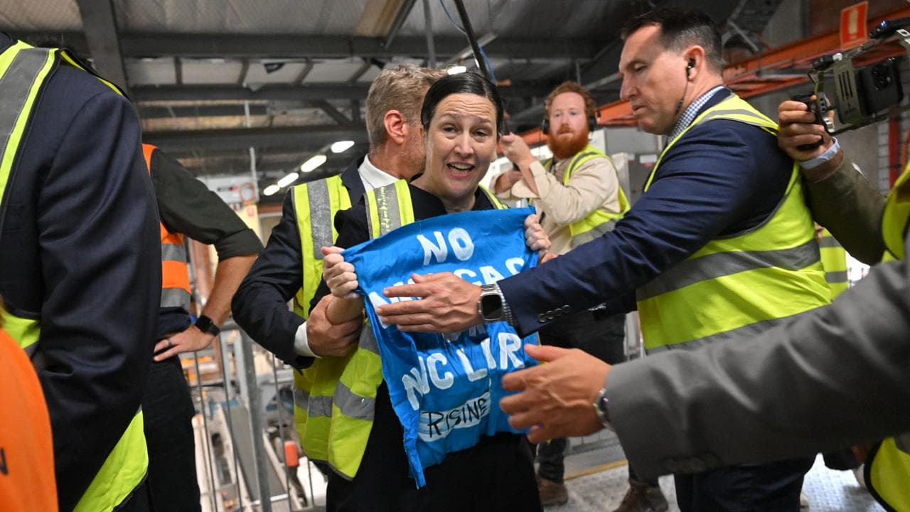 A protester confronts Peter Dutton at the XXXX brewery in Brisbane