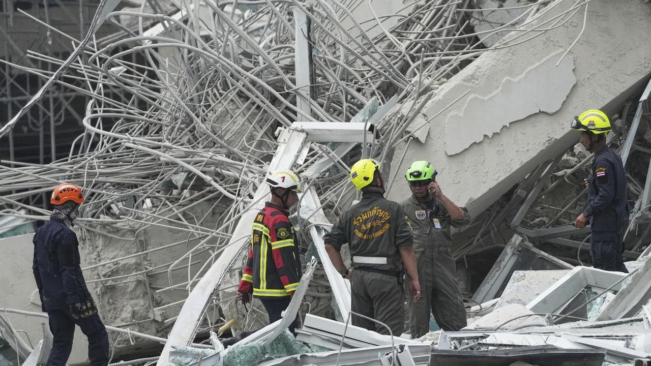Rescuers search for victims at a collapsed high-rise in Bangkok