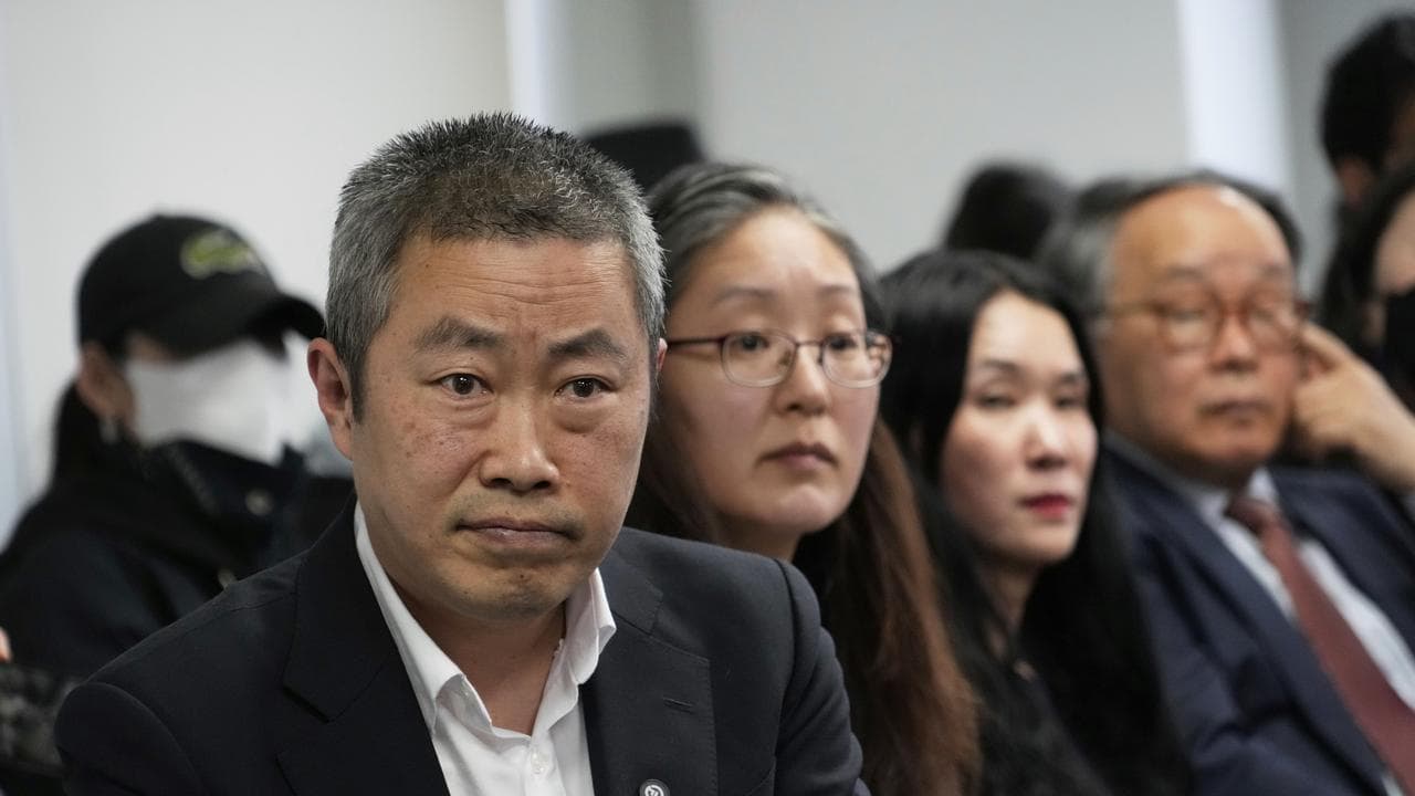 Peter Møller and Boonyoung Han from Danish Korea Rights Group,