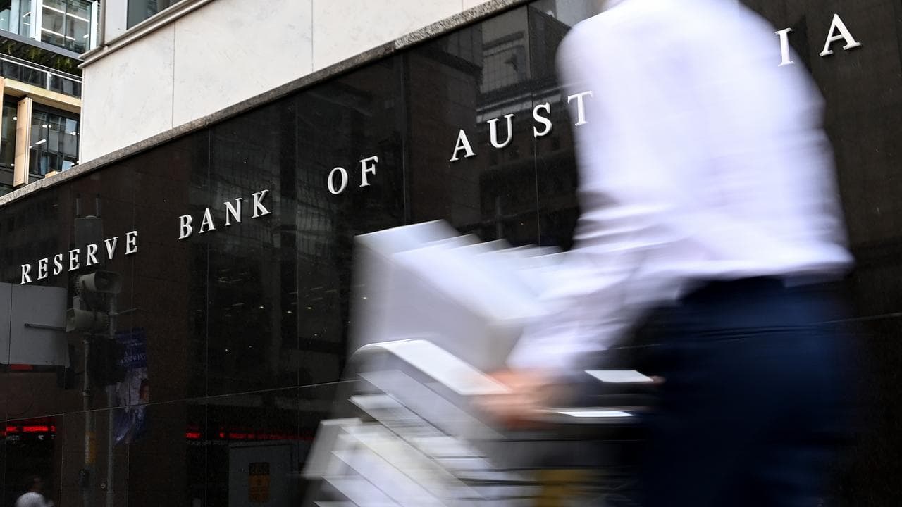 Person walks past the Reserve Bank of Australia building