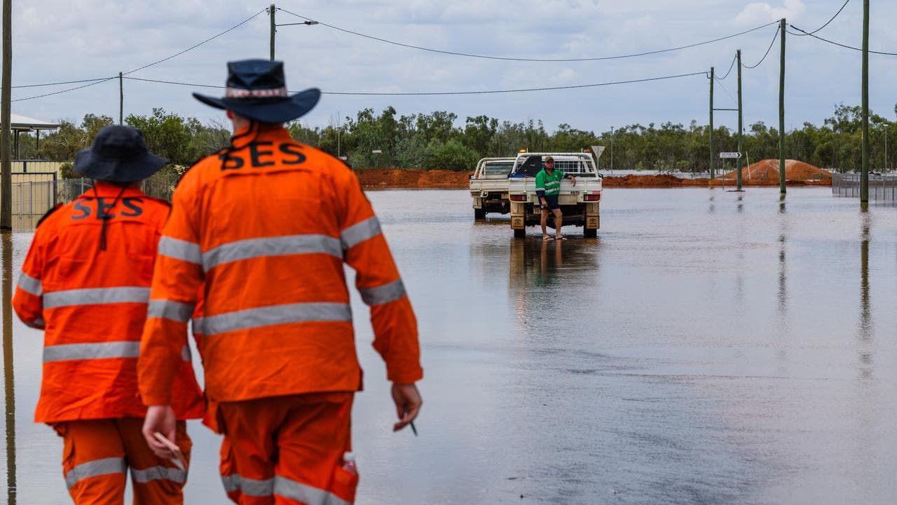 SES personnel assess flooding at Thargomindah, Queensland.