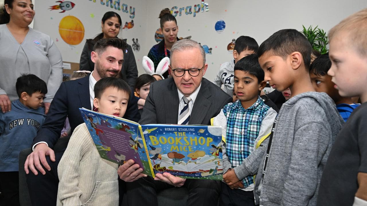 Prime Minister Anthony Albanese reads a book to children