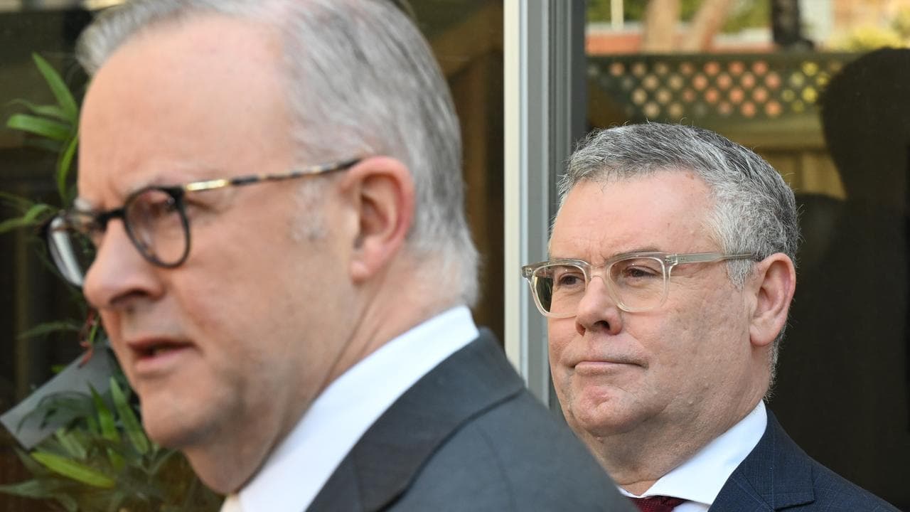 Murray Watt listens to Prime Minister Anthony Albanese