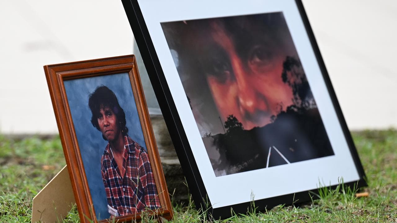 Framed portraits of Mark Haines (file)