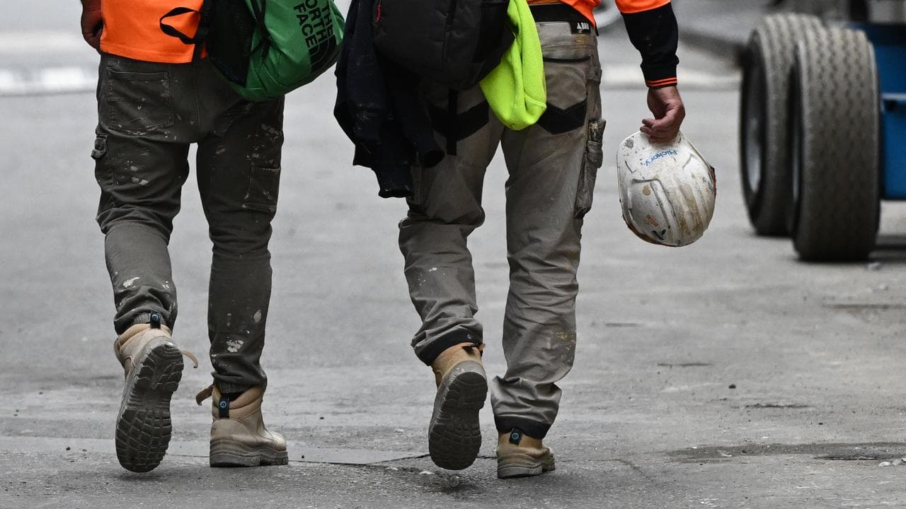 A couple of tradies walking down the street