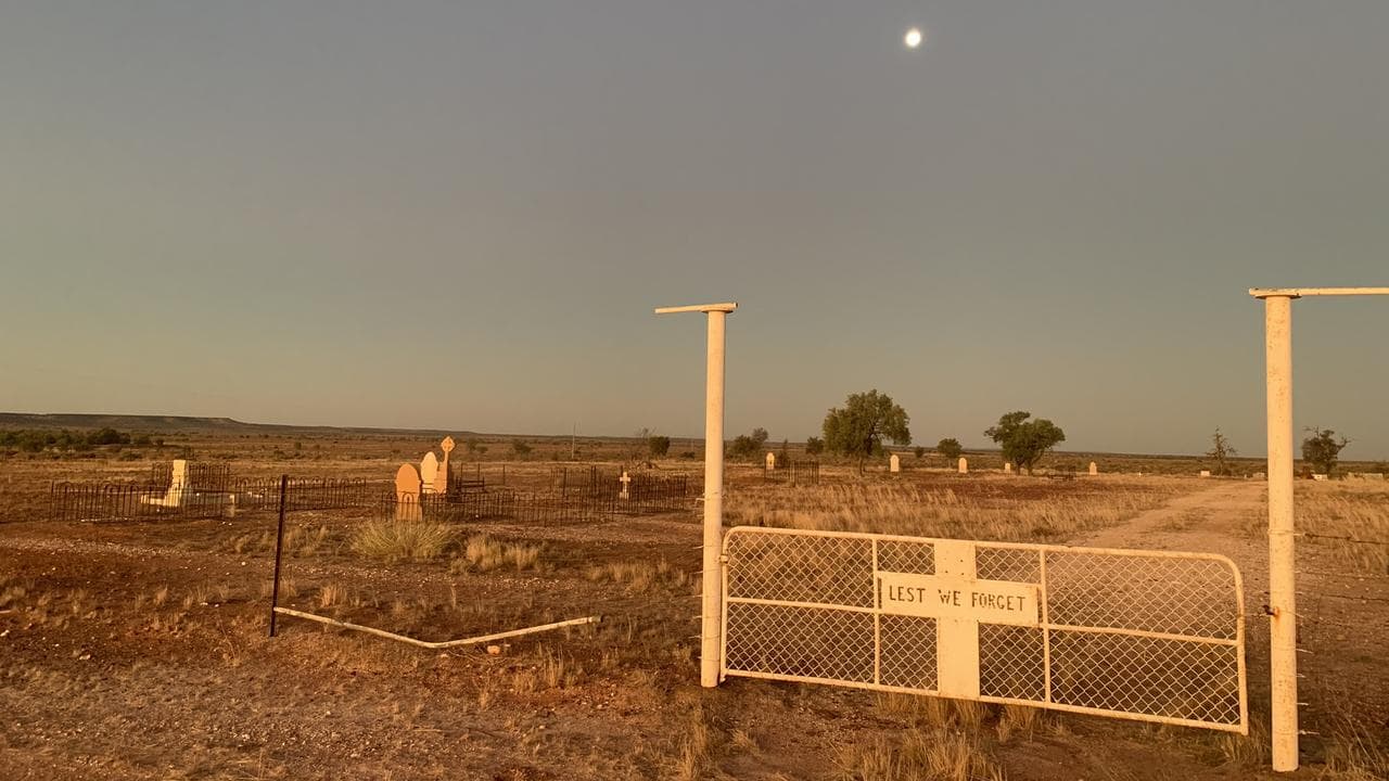 The moon rises over White Cliffs cemetery