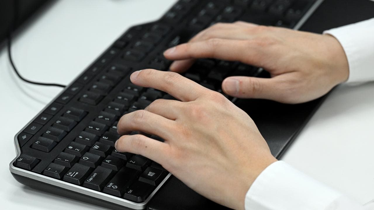 Person types on a computer