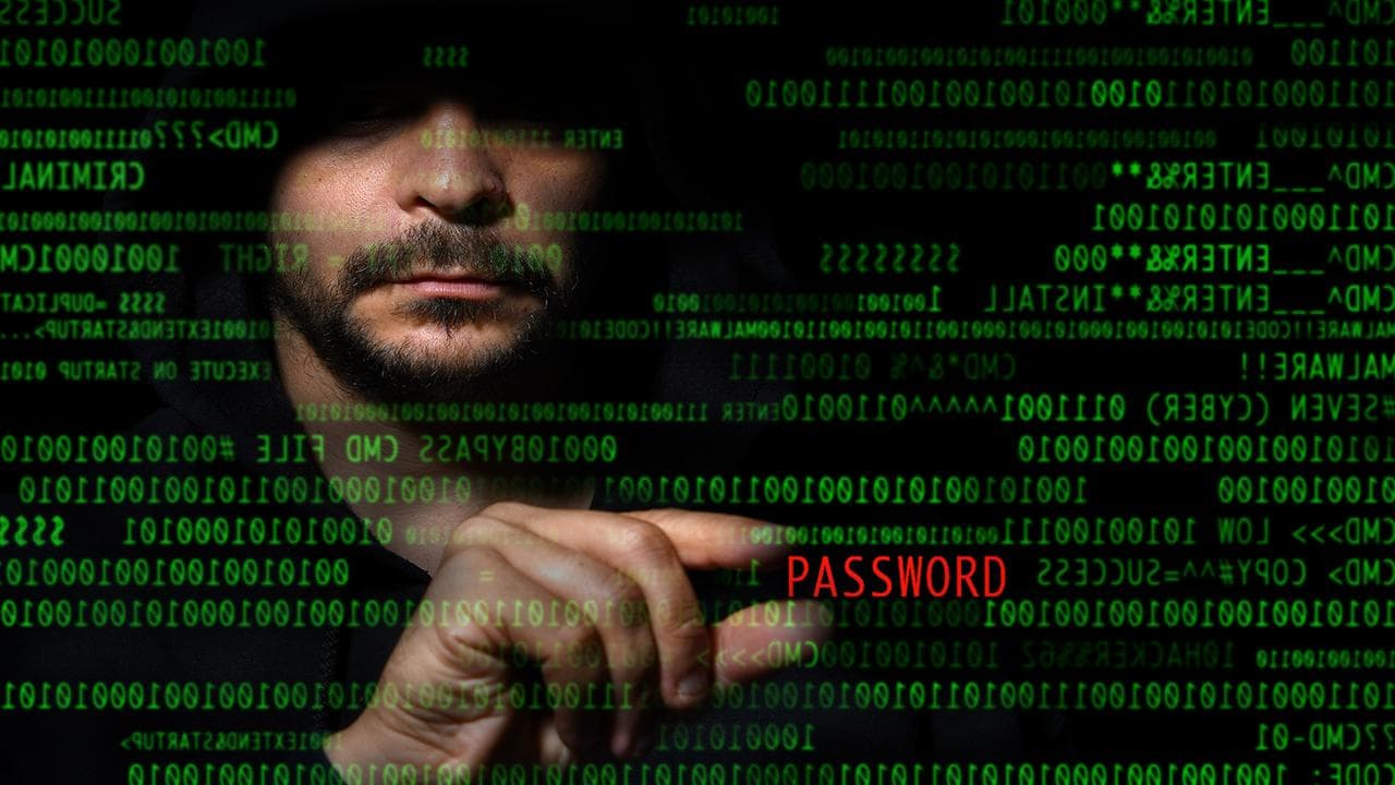 Graphic representation of a hacker stealing a password