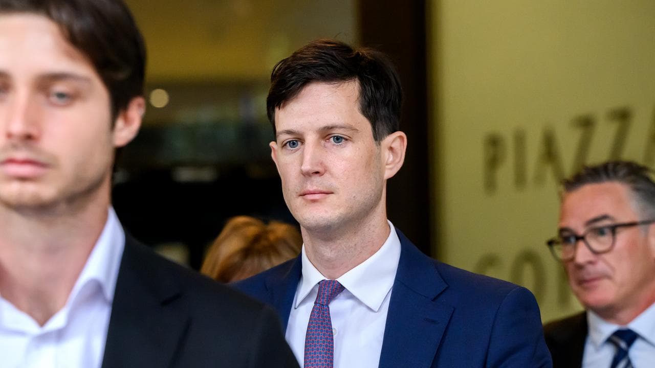 Rory Amon (centre) departs the Downing Centre District Court